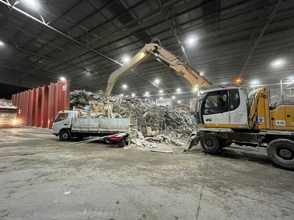 Rubbishgo delivers Hard Rubbish Collection, with an excavator loading waste into a truck.