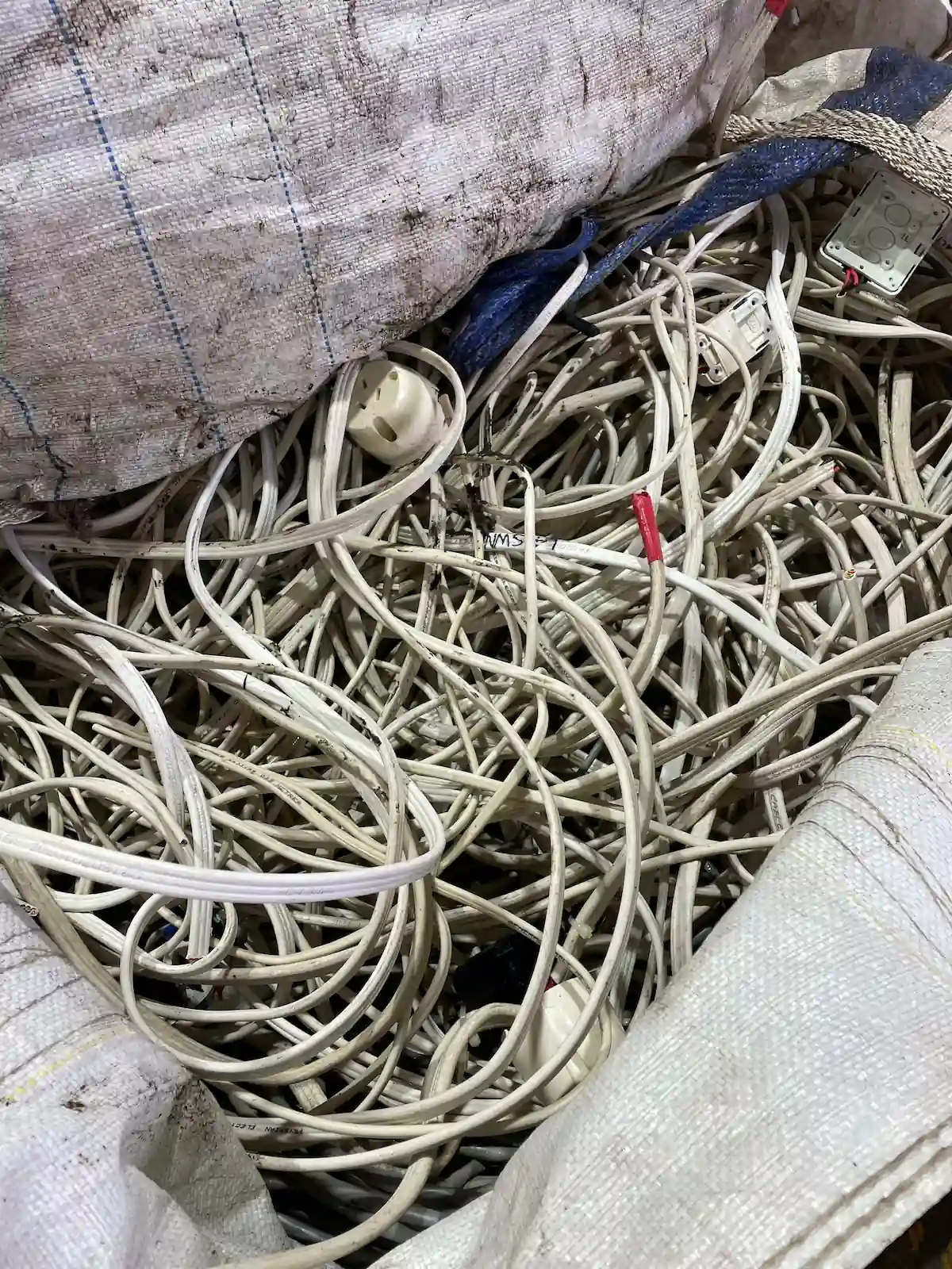 Tangled cables packed in bags ready for safe e waste recycling near me, preventing landfill waste in Central Coast.