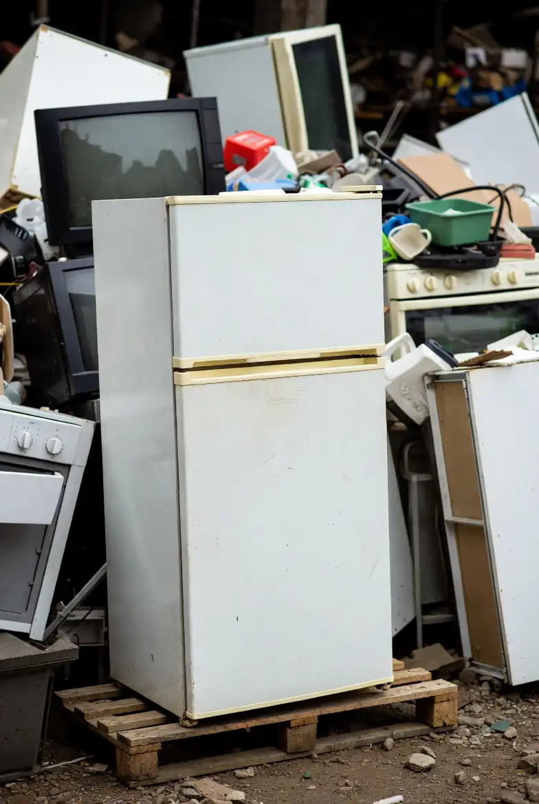 “Household items including white fridge and stove ready for white goods removal”